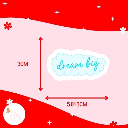 Measurement chart with 'dream big' text on a red and pink background. The sticker is 3cm tall and 5.843cm wide.
