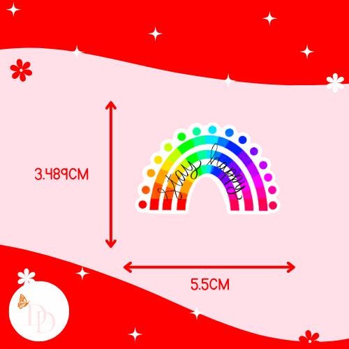 Colourful rainbow "stay happy" design with measurements on a red and pink background. The sticker is 3.489cm high and 5.5cm wide.