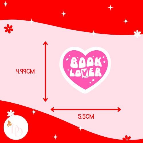 Heart-shaped 'Book Lover' design with measurements on a red and pink background. The sticker is 4.99cm high and 5.5cm wide.